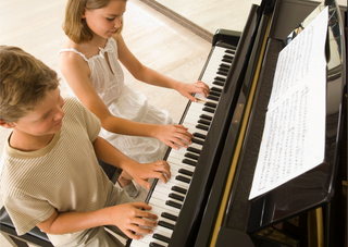 Striking the Right Chord: Unveiling the Multifaceted Benefits of Piano Lessons